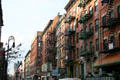 Streetscape along Orchard St. reflects New York of old including Tenement Museum. New York, NY.