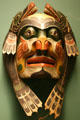 Kwakwaka'wakw mask of two sea lions around ancestor face at National Museum of American Indian. New York, NY