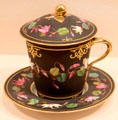Porcelain covered cup & saucer by Edouard Honoré of Paris at Metropolitan Museum of Art. New York, NY.