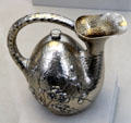 Silver wine pot in shape of askos by Dominick & Haff of New York City at Metropolitan Museum of Art. New York, NY.