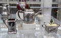 Silver Japanese-style teapot, sugar & creamer by Tiffany & Co. of New York City at Metropolitan Museum of Art at Metropolitan Museum of Art. New York, NY.