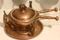 Copper chafing dish supported by rabbits by Joseph Heinrichs at Metropolitan Museum of Art. New York, NY.