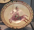 Redware sgraffito plate with Light Dragoon soldier from Pennsylvania at Metropolitan Museum of Art. New York, NY.
