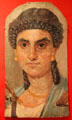 Greco-Romano-Egyptian mummy portrait of woman in blue mantle at Metropolitan Museum of Art. New York, NY.