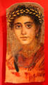Romano-Egyptian mummy portrait of woman in red at Metropolitan Museum of Art. New York, NY.