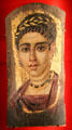 Romano-Egyptian mummy portrait of woman in gilded wreath at Metropolitan Museum of Art. New York, NY.