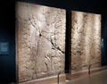 Two reliefs of Assyrian genies from King Ashur-nasir-pal II palace of Nimrud at Brooklyn Museum. Brooklyn, NY.