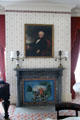 Drawing room gray marble fireplace mantles with two Argand lamps, wallpaper-covered fireboard under portrait of Martin Van Buren at Lindenwald. Kinderhook, NY.