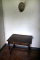 Table & candle holder in Schenck House at Old Bethpage Village. Old Bethpage, NY.