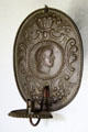 Wall candle holder with classical head in Schenck House at Old Bethpage Village. Old Bethpage, NY.