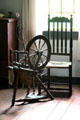 Spinning wheel in Schenck House bedroom at Old Bethpage Village. Old Bethpage, NY.