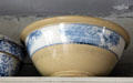 Yellow annular ware bowl with blue seaweed decoration in Layton General Store at Old Bethpage Village. Old Bethpage, NY.