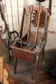 Hand-cranked washing machine to agitate clothing in Layton General Store at Old Bethpage Village. Old Bethpage, NY.