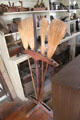 Sales stand to display brooms in Layton General Store at Old Bethpage Village. Old Bethpage, NY.