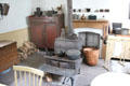 Kitchen with cast iron stove in Layton Home at Old Bethpage Village. Old Bethpage, NY.