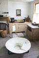 Sheet metal sponge bath with seat in kitchen of Layton Home at Old Bethpage Village. Old Bethpage, NY.