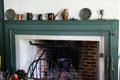 Fireplace with vessels in Cooper House at Old Bethpage Village. Old Bethpage, NY.