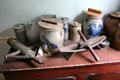 Sausage stuffer, rolling grinder & stoneware crocks in Powell House at Old Bethpage Village. Old Bethpage, NY.