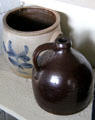 Stoneware crock & whiskey jug in kitchen of Williams House at Old Bethpage Village. Old Bethpage, NY.