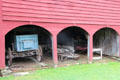 Barn with horse drawn freight wagon & log sledge at Old Bethpage Village. Old Bethpage, NY.