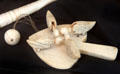 Carved ivory pecking birds paddle toy at Sag Harbor Whaling Museum. Sag Harbor, NY.