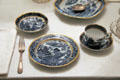 Place setting with monogrammed silver fork & blue willow ware pattern plate at Home Sweet Home Museum. East Hampton, NY.
