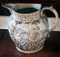 Lusterware pitcher with detailed floral design in white on silver at Home Sweet Home Museum. East Hampton, NY.