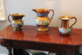 Copper lusterware pitchers with multicolor floral designs at Home Sweet Home Museum. East Hampton, NY.