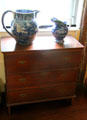 Antique pitchers with blue printed design on antique chest of drawers at Home Sweet Home Museum. East Hampton, NY.
