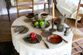Colonial table setting with pewter dishes and primitive knives & forks at Thomas Halsey Homestead. South Hampton, NY.