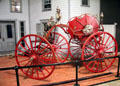 Firefighting four-wheeled "spider" hose cart at carriage collection of Long Island Museum. Stony Brook, NY.