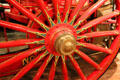 Detail of wooden carriage wheel of steam pumper by Amoskeac Manu. Co. of Manchester, NH at carriage collection of Long Island Museum. Stony Brook, NY.