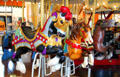 Three horses on Merry-Go-Round Museum's working carousel. Sandusky, OH.