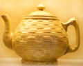 Pressed basket weave teapot by C.C. Thompson Pottery Co. at Museum of Ceramics. East Liverpool, OH.