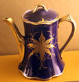 Semi-porcelain Whiteware pitcher in dark blue with gold trim by Vodrey Pottery Co. of East Liverpool at Museum of Ceramics. East Liverpool, OH.