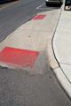 Example of sidewalk wheelchair ramp extending into street to prevent illegal parking. Columbus, OH.