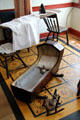 Cradle & ironing board in Whitney home at Historic Kirtland Village. Kirtland, OH.