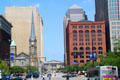 North side of Cleveland Public Square with Old Stone Church & Society National Bank framing Cuyahoga County Courthouse at end of street. Cleveland, OH.
