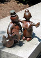 Whimsical statuette of patron with dollar sign by Tom Otterness at Cleveland Public Library. Cleveland, OH.
