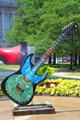 Cleveland Guitar Mania painted guitar shows peacock pattern by Martin Boyle. Cleveland, OH
