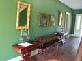 Hallway in Jonathan Goldsmith House with double chair bench, side tables & mirrors at Hale Farm. Cleveland, OH.