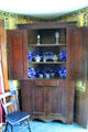 Corner cabinet with blue-flow porcelain in Clement Jagger House at to Hale Farm. Cleveland, OH.