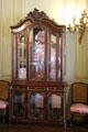 Cabinet with collection of 16th-century Venetian glass in Breakfast Room at The Breakers. Newport, RI.
