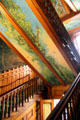 Grand staircase in Eastlake style with mural by Richard Morris Hunt at Chateau-sur-Mer. Newport, RI.