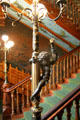 Grand staircase with torchere at Chateau-sur-Mer. Newport, RI.