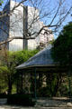 Gardens of former Ursuline Academy with highrises beyond. San Antonio, TX.