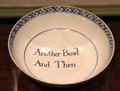 Antique ceramic punchbowl inscribed "Another Bowl And Then" at Bayou Bend. Houston, TX.