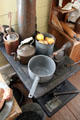 Cast iron stove with pots in San Felipe Cottage at Sam Houston Park. Houston, TX