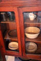 Kitchen cabinet with dishes at O.Henry House Museum. San Antonio, TX.