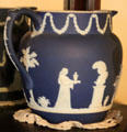White on blue bisque pitcher show woman with urn at Edward Steves Homestead Museum. San Antonio, TX.
